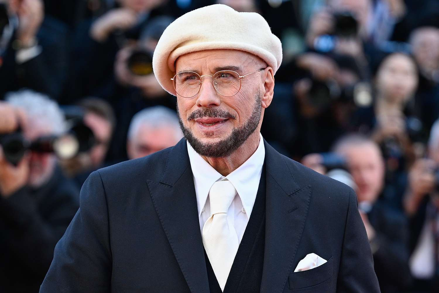 John Travolta's Three Berets at Cannes — He Piloted Himself to the Premiere!